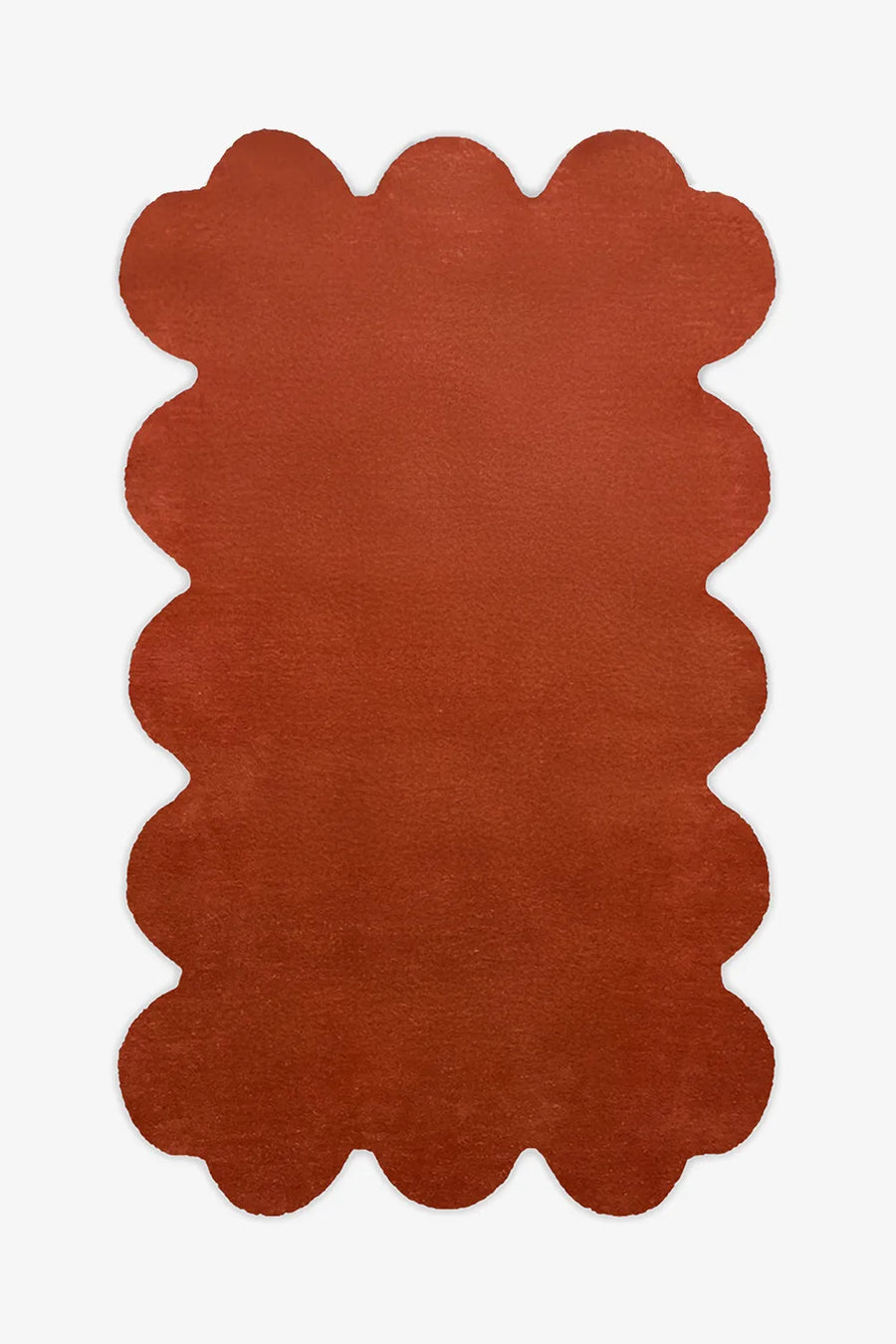 8x10 burnt orange scalloped wool rug with hand-tufted plush pile and sculptural edge design, ideal for modern living rooms