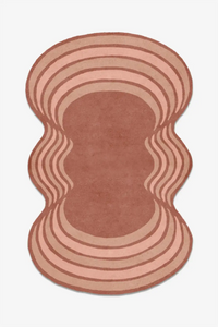 Rounded wool custom rug with wavy design on a white background