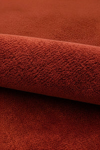 Close-up of burnt orange wool rug