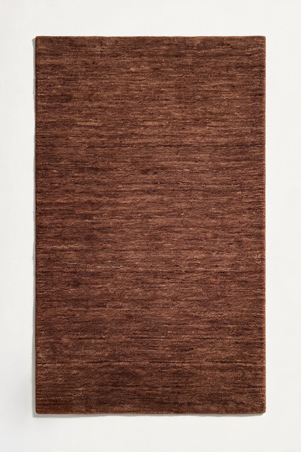 brown loomed wool rug modern neutral  | Haven in Chestnut without stitched binding