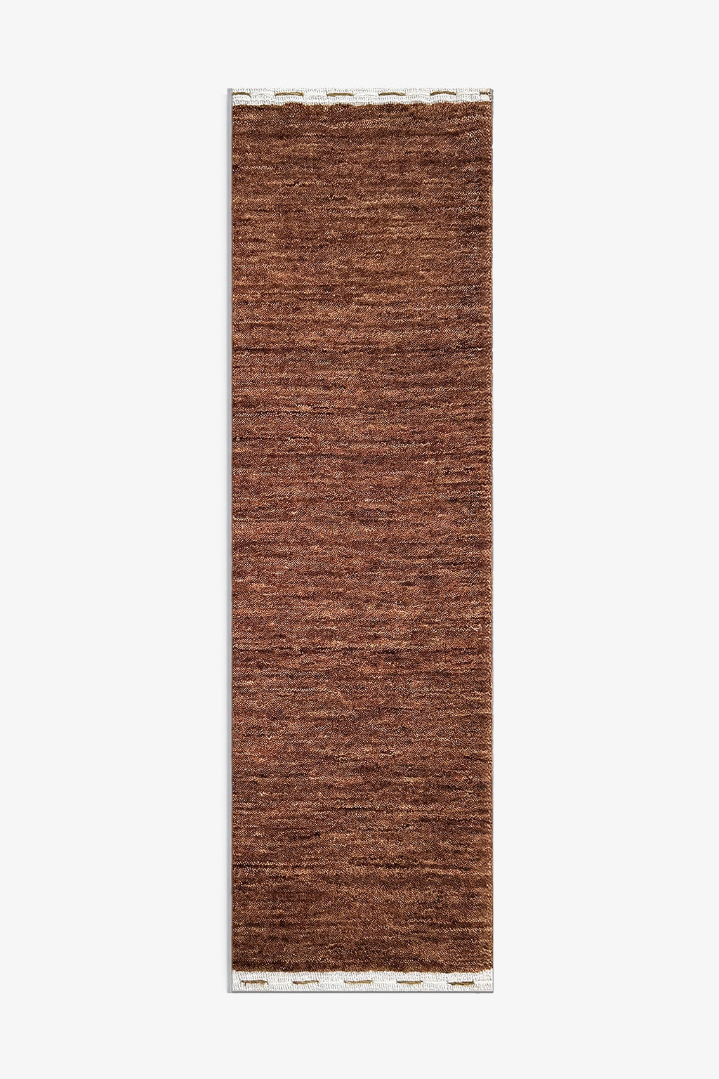 A long, narrow brown woven rug or mat with a textured, heathered surface and a white fringed edge, shown flat against a light gray background chestnut