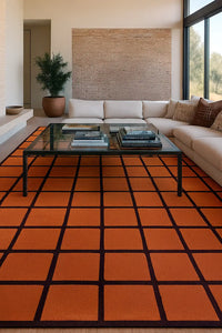 orange terracotta large wool area rug with burgundy grid lines in modern southwestern style living room lifestyle