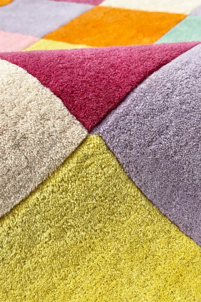Detail of multicolor checkered shag rug, funky colorful geometric rug texture