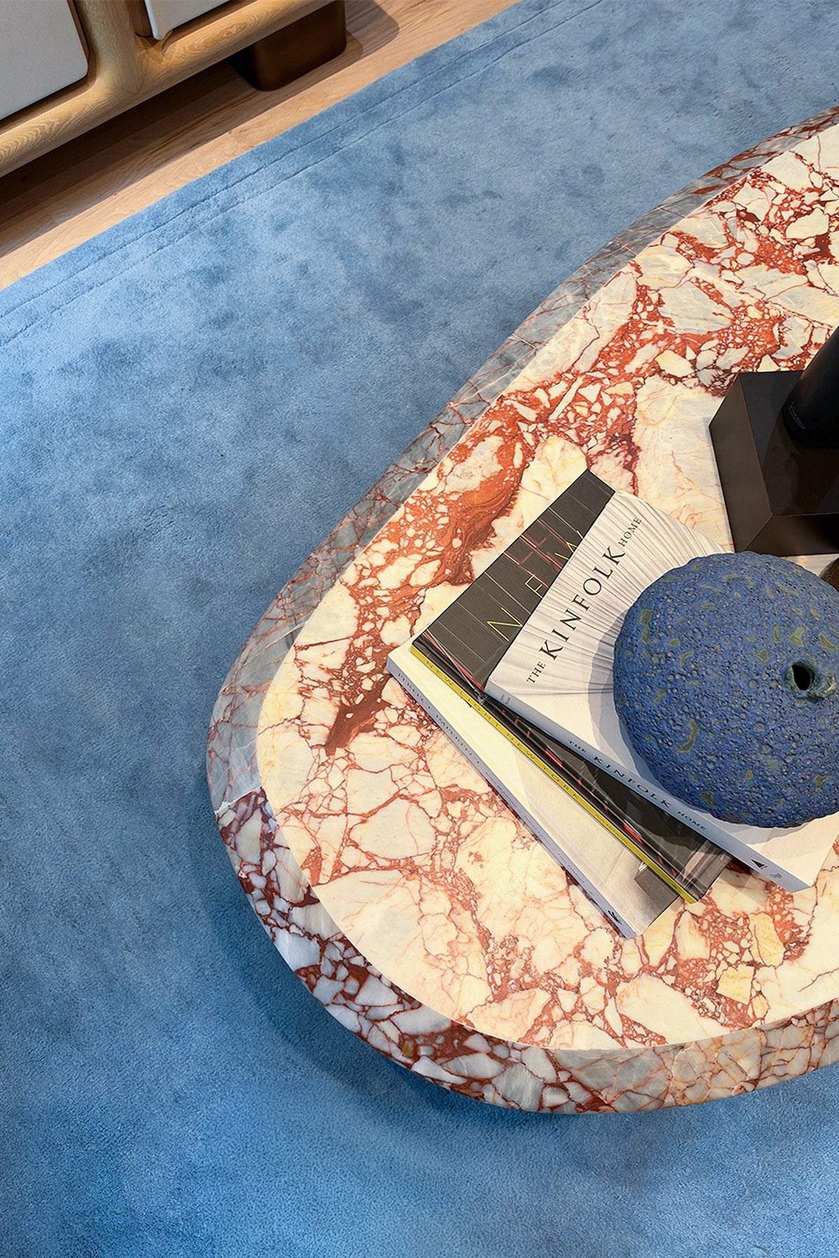 blue rug with a marble table