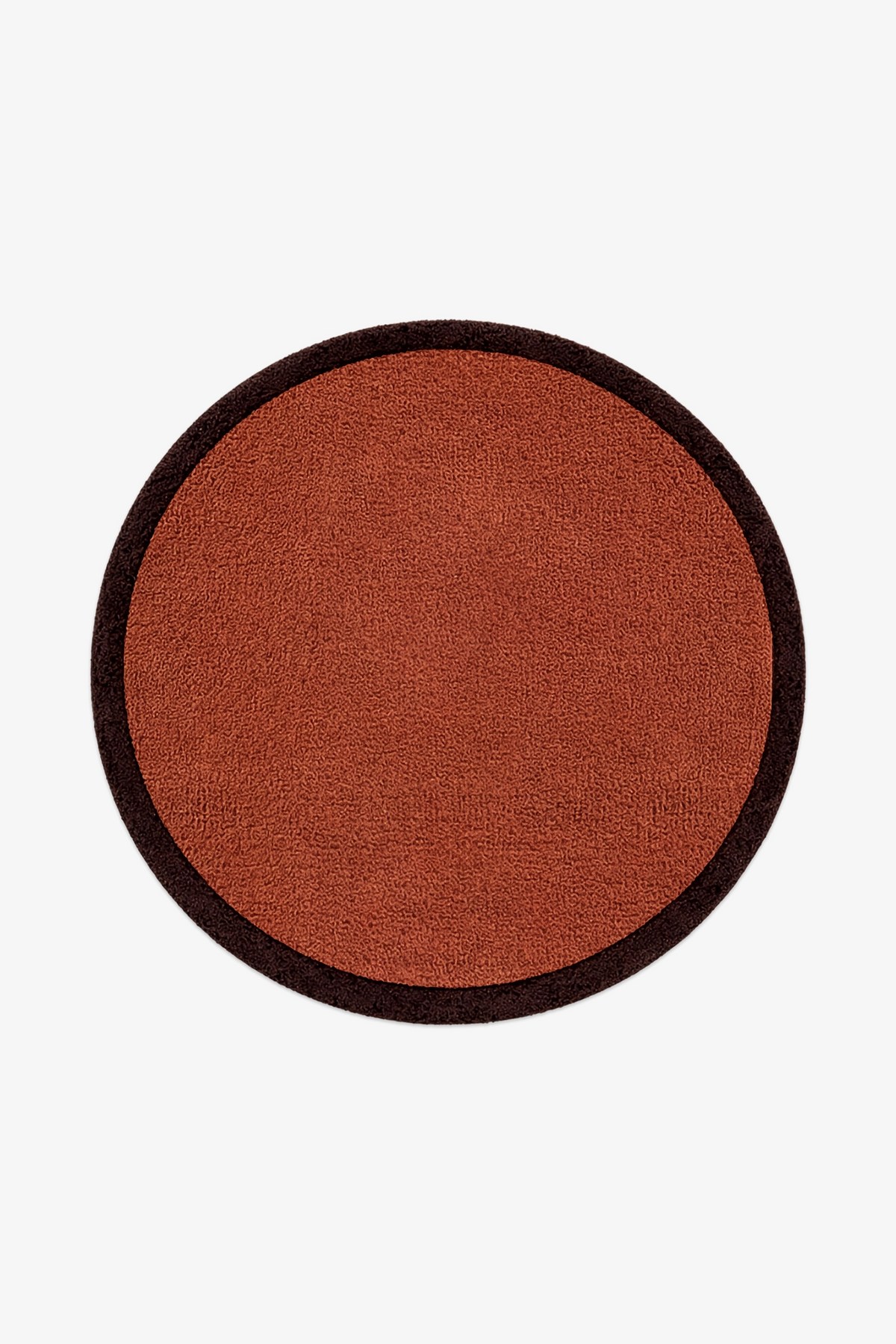 A round wool rug with a rust-orange textured center and a dark brown border, shown flat against a light gray background.