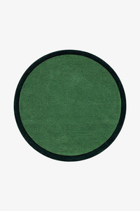 A round green rug with a contrasting black border, shown flat against a solid white background.
