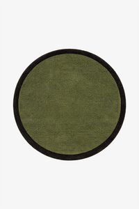 A round rug with an olive textured center and a contrasting forest border, shown flat against a plain white background.
