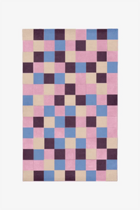 Bright checkered wool rug in soft cream with accents of blue and pink