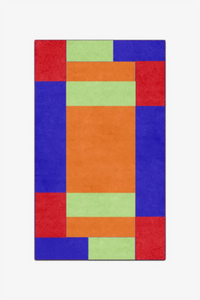 Colorful geometric patterned rug on a white background