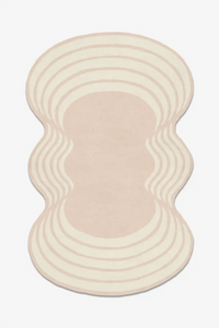 Wavy pink and beige rug on a white background