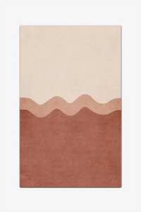 Rectangular rug with rust and cream a two-tone design on a white background
