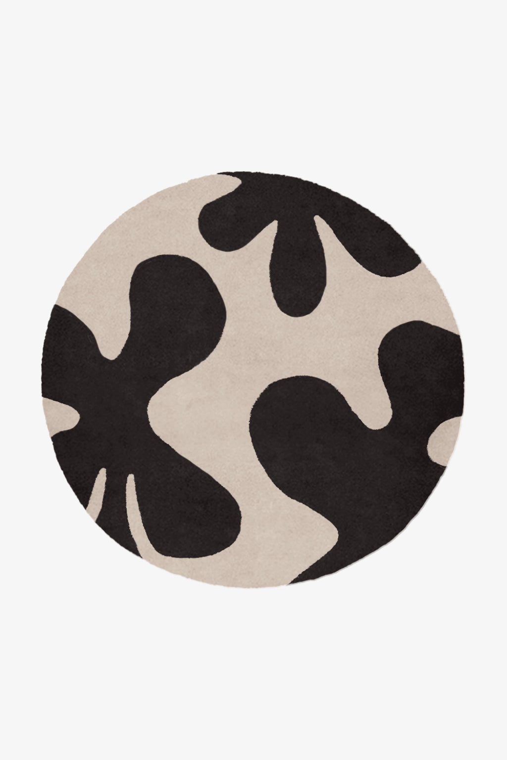 Round rug with black and beige abstract pattern on a white background