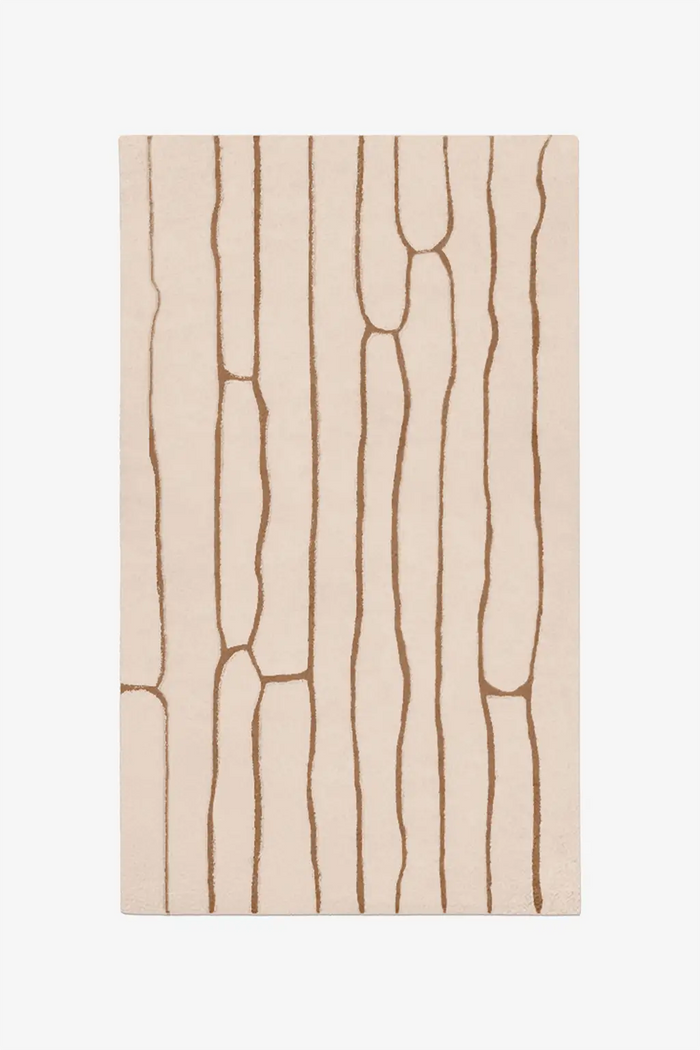 custom beige rug with brown abstract line pattern on a white background