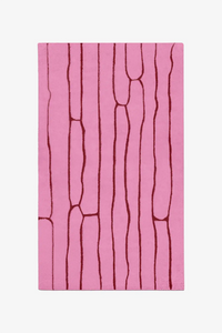 custom wool rug with pink and red abstract pattern on a white background