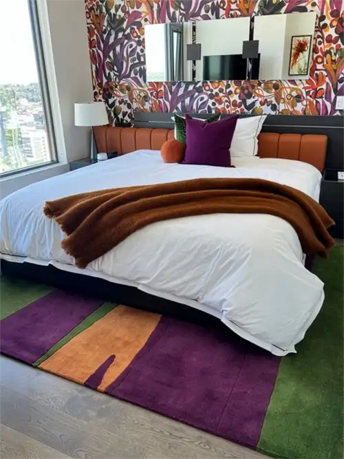 custom bespoke rug in custom cut size and color palette for modern colorful bedroom