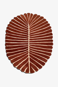 custom color leaf-shaped rug with white veins on a white background