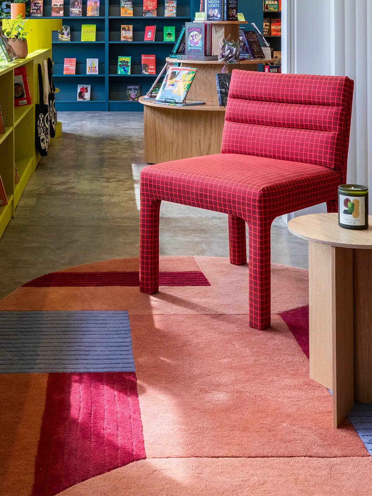 custom made wool rug with modern geometric design and unique color palette in designer bookstore