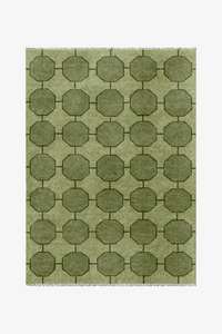custom green geometric patterned rug in hand-knotted wool on a white background