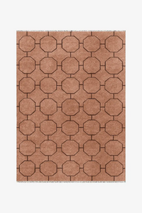custom patterned rug with geometric design on a plain background