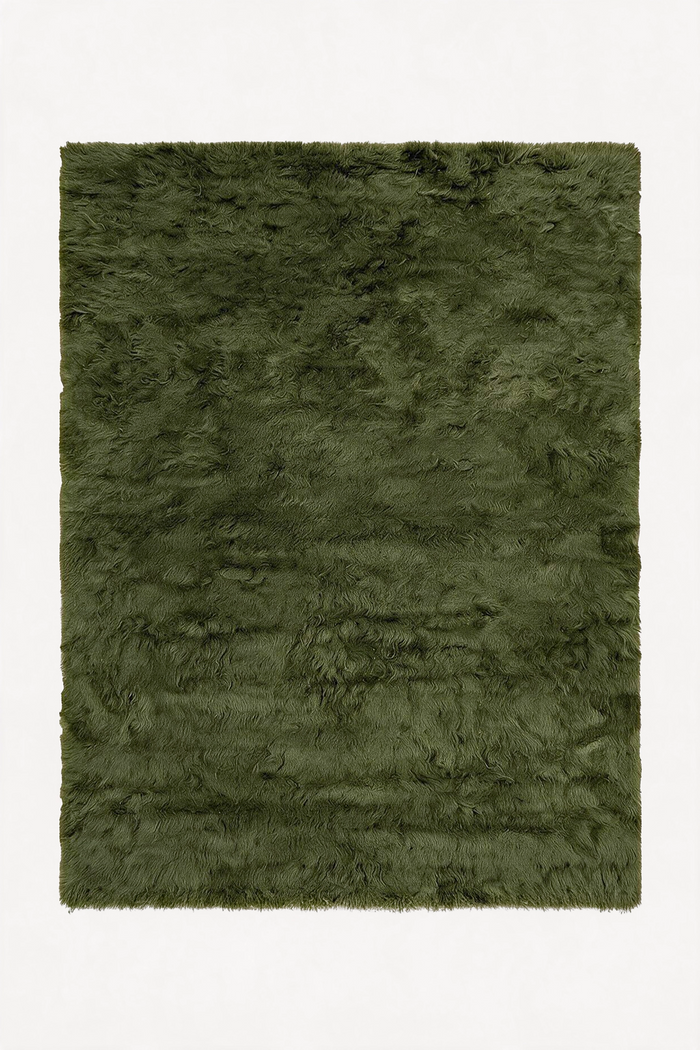 An olive green shaggy wool rug shown from a top-down view against a plain white background.