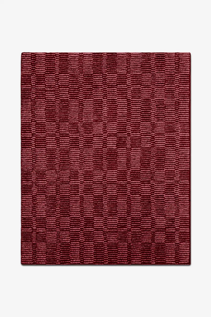 Red patterned rug on a white background