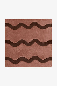 Terracotta and dark brown square wool rug featuring a playful wave pattern, available in 7x7 and 8x8 sizes for cozy playrooms or boho bedrooms