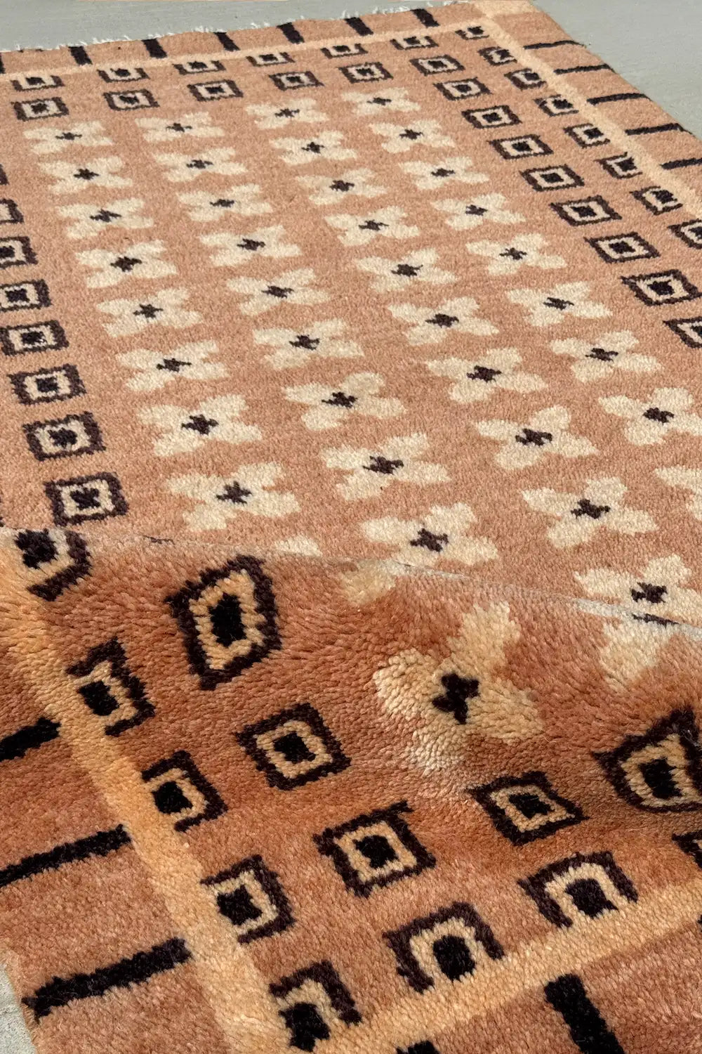 Tan and brown wool rug with intricate knotted texture and desert-inspired box matrix pattern, modern geometric area rug