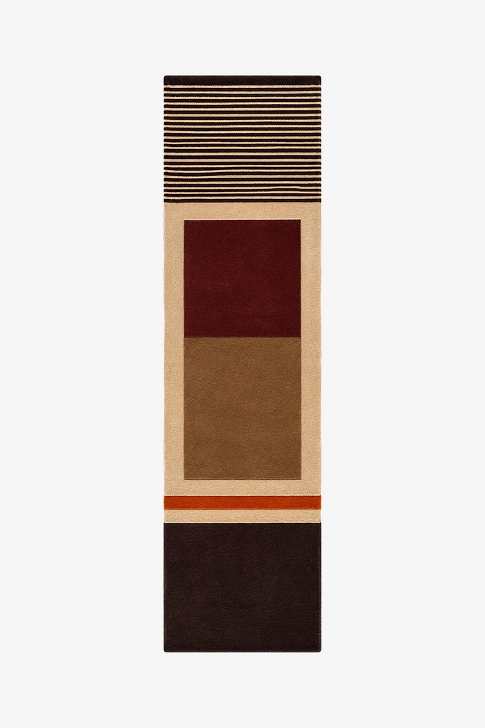 A long, narrow geometric runner rug with blocks and stripes in beige, brown, burgundy red, and dark brown, shown flat against a light gray background.