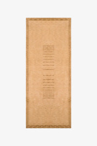 gold textured runner rug on a white background