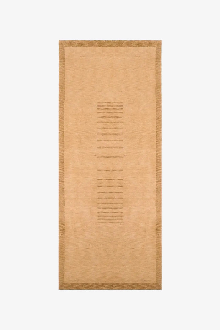 gold textured runner rug on a white background