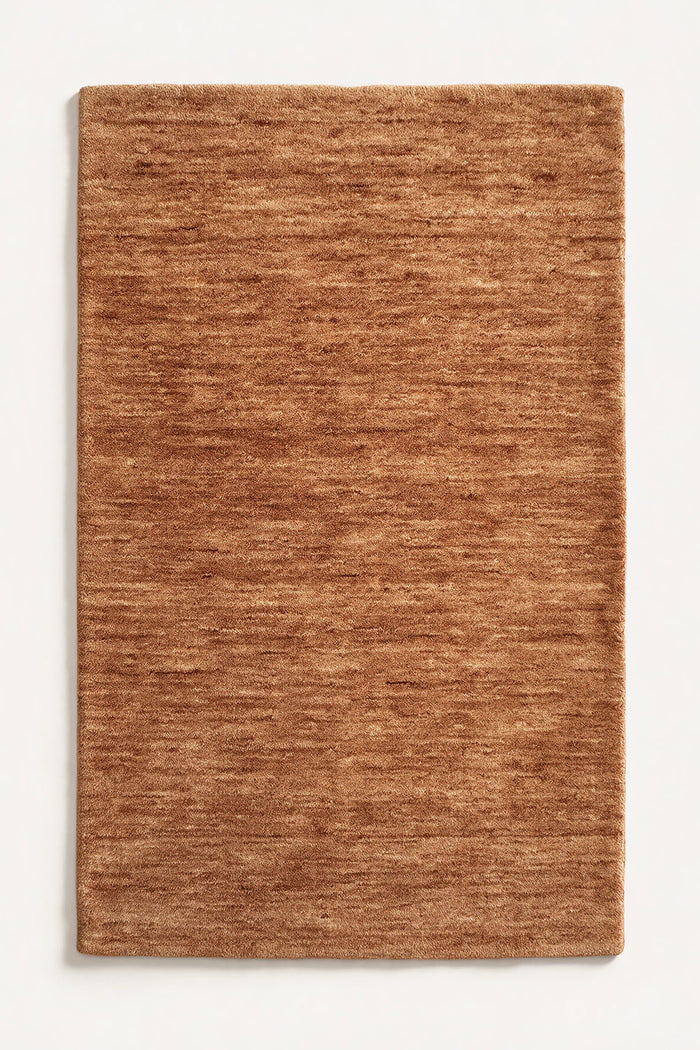 a camel haven hand-loomed wool rug with plain edges and no stitched binding, shown flat on a white background  | Haven in Camel without stitched binding
