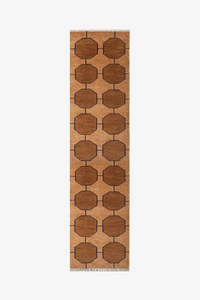 warm golden brown patterned runner rug on a white background