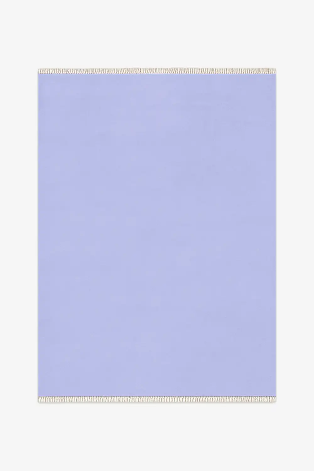 Light blue rug with white fringe on a white background