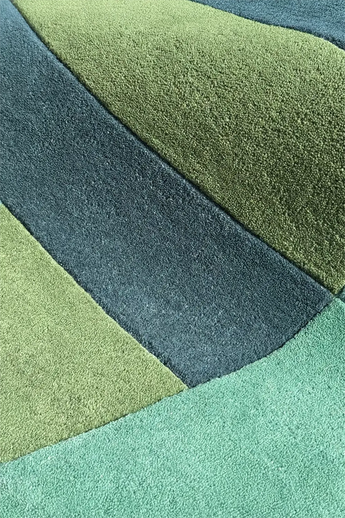 close up texture detail of blue and green wool runner rug