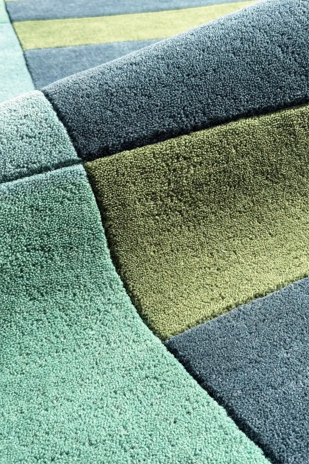 plush texture of a teal and navy square rug