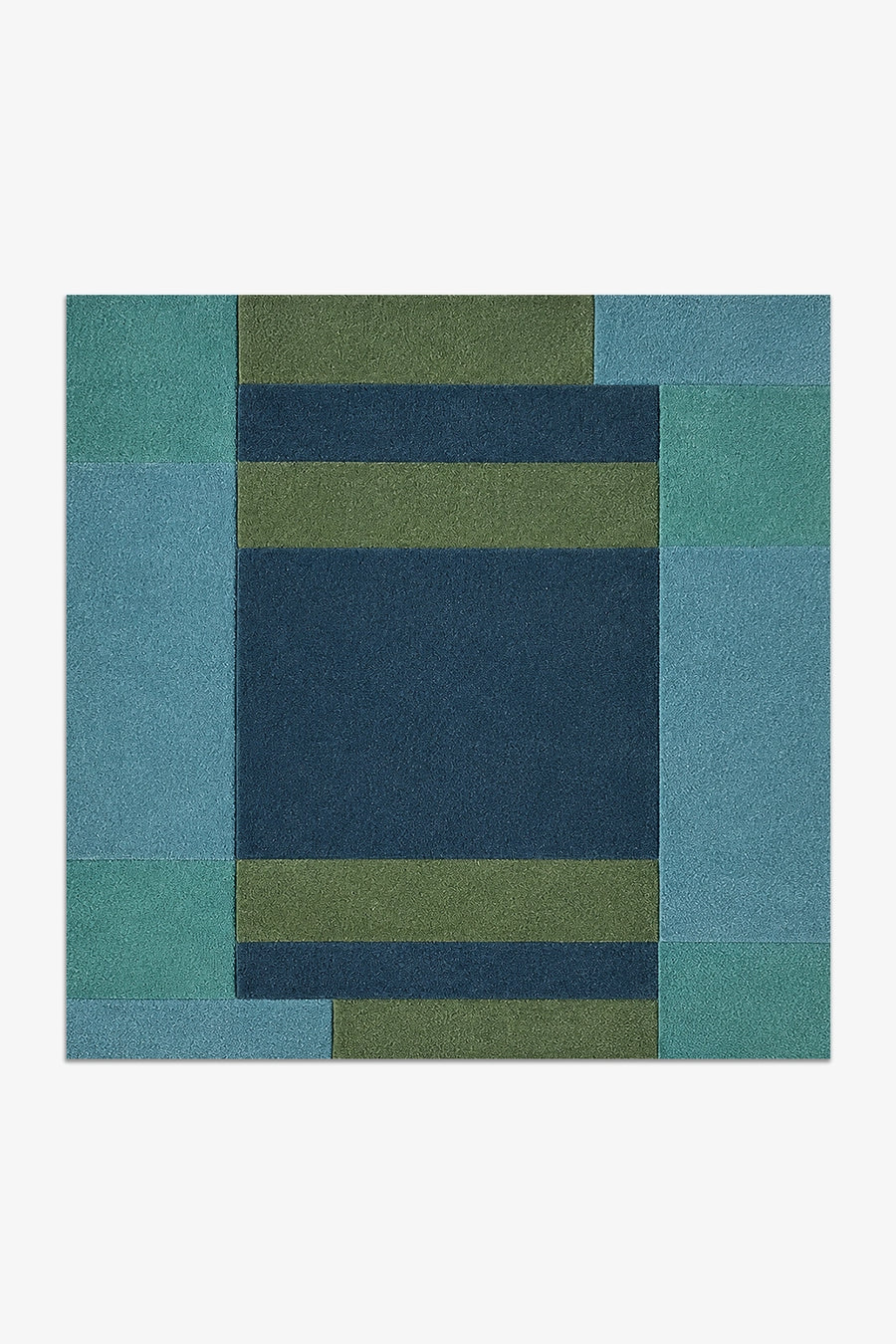 square rug with a geometric pattern of blue and green squares on a white background