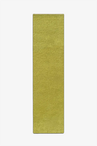 long lime green wool runner rug on a white background