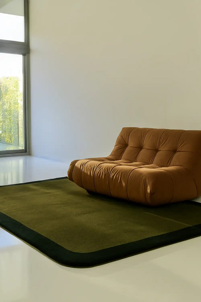 Hand-tufted modern wool rug in olive, styled in a living room with neutral decor lifestyle