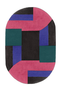 Black, pink, and green oval wool rug with modern abstract color blocking and sculptural hand-tufted texture