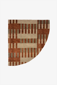 A curved, wedge-shaped area rug with a geometric pattern of rust brown, beige, and muted sage green stripes, shown flat against a solid white background multicolor