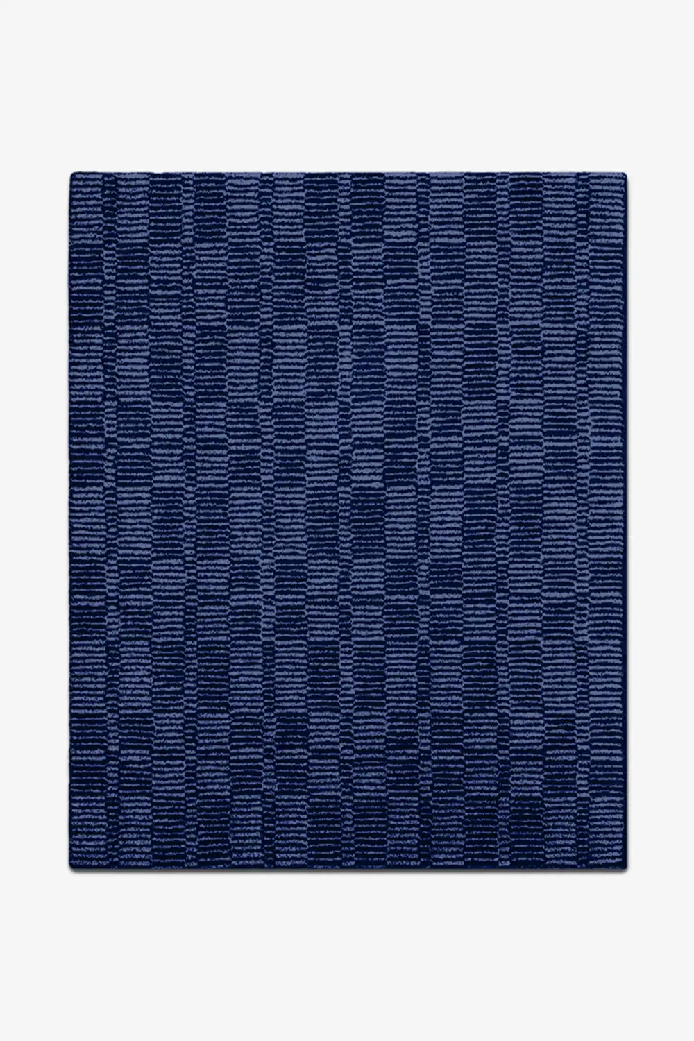 Navy blue textured rug on a white background