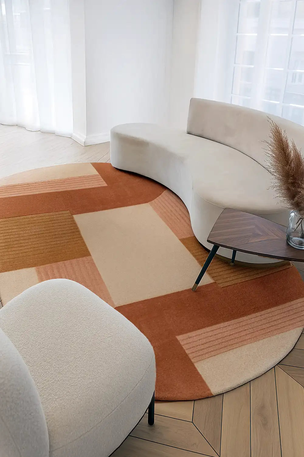 orange tan and peach 8x10 oval rug in a modern sun-lit neutral living room