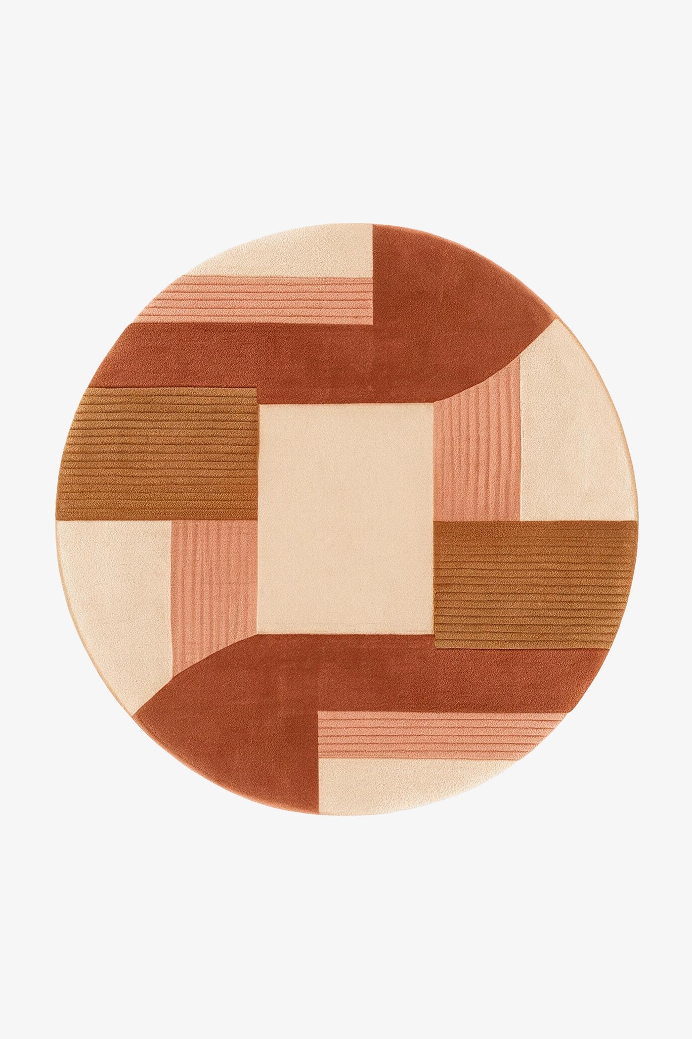 A round area rug with a geometric patchwork design in terracotta, dusty pink, beige, and brown, shown from a top-down view on a light gray background.