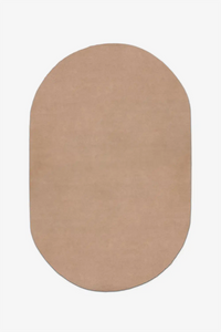 Beige light brown oval tufted rug on a white background