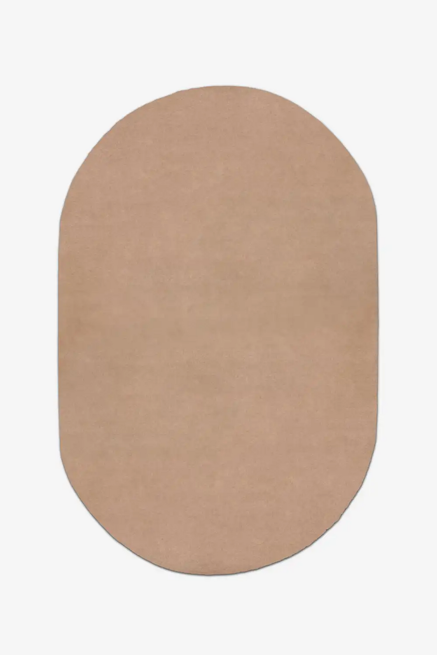 Beige oval tufted rug on a white background