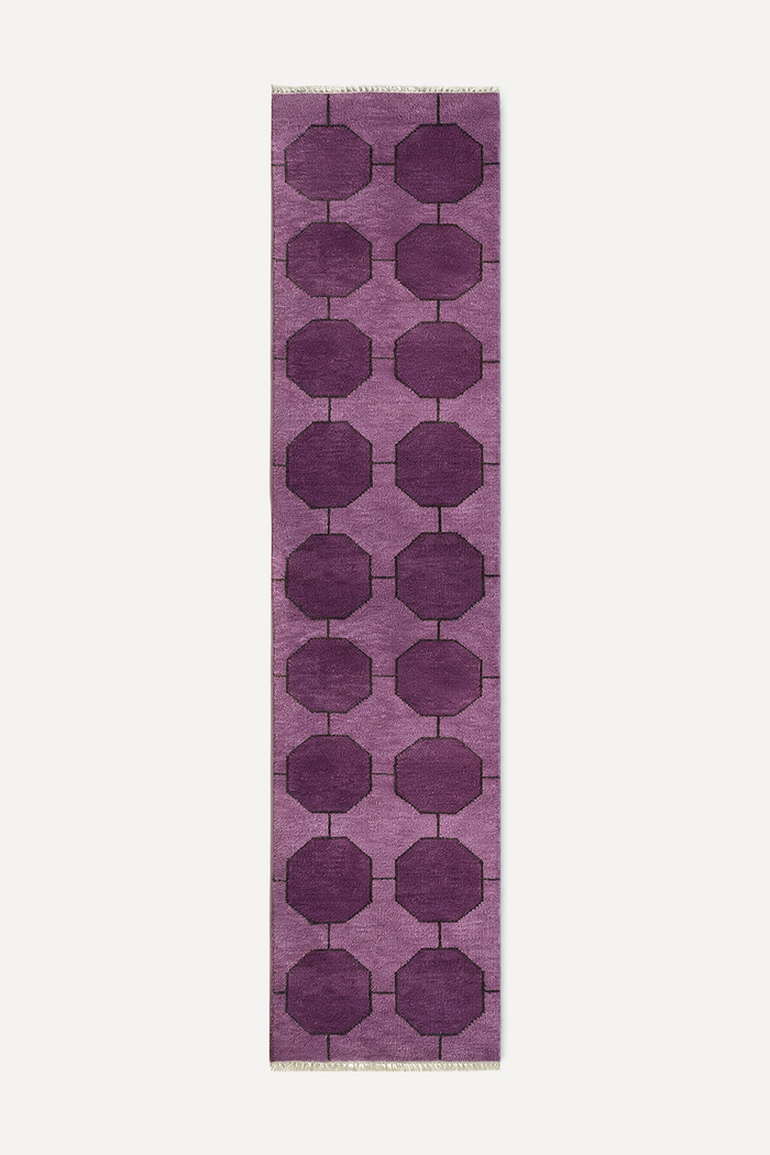 a purple runner rug with a geometric octagon pattern