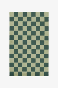 Custom olive green and forest wool rug in modern checkered pattern
