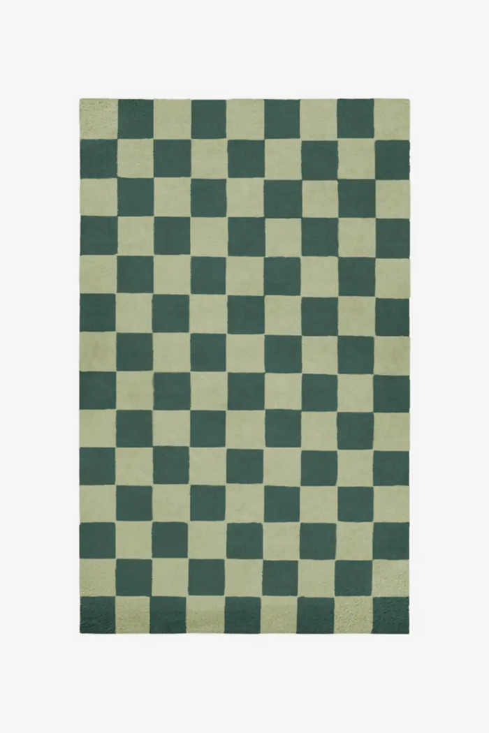 Custom olive green and forest wool rug in modern checkered pattern
