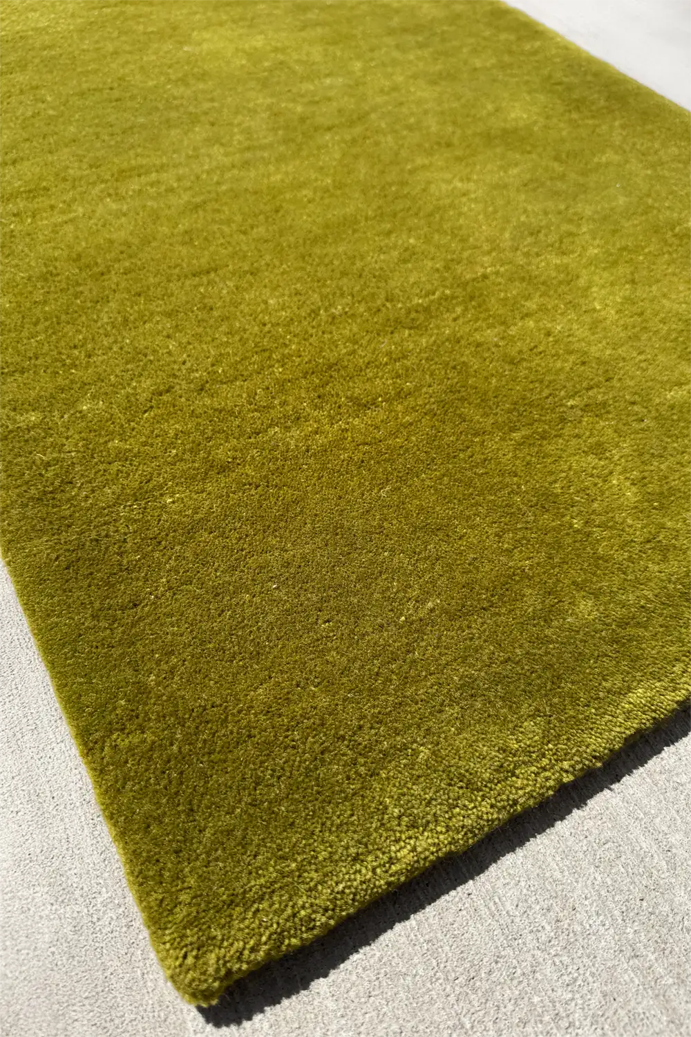 mcm green rug on a light gray floor