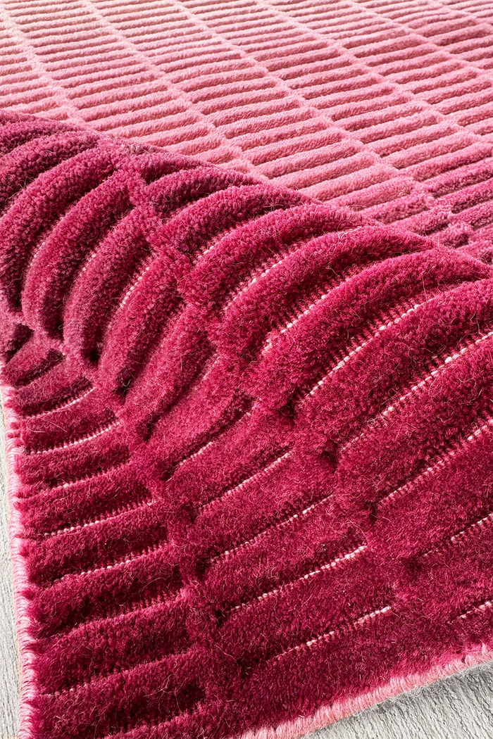 close up texture of a pink wool runner rug